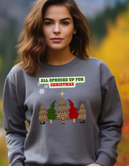 Woman wearing a gray sweatshirt with Christmas-themed design and text.